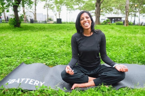 Tejal Patel, yoga teacher and co-host of Yoga is Dead podcast, practicing yoga in a park