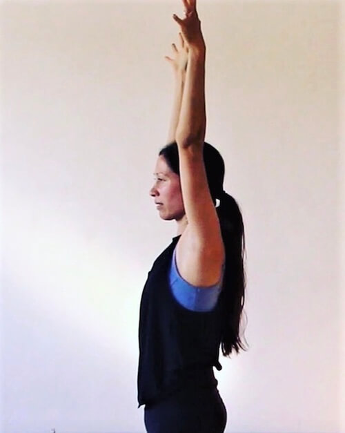 Monique Minahan, author and yoga teacher, demonstrating an empowering pose from her grief practice