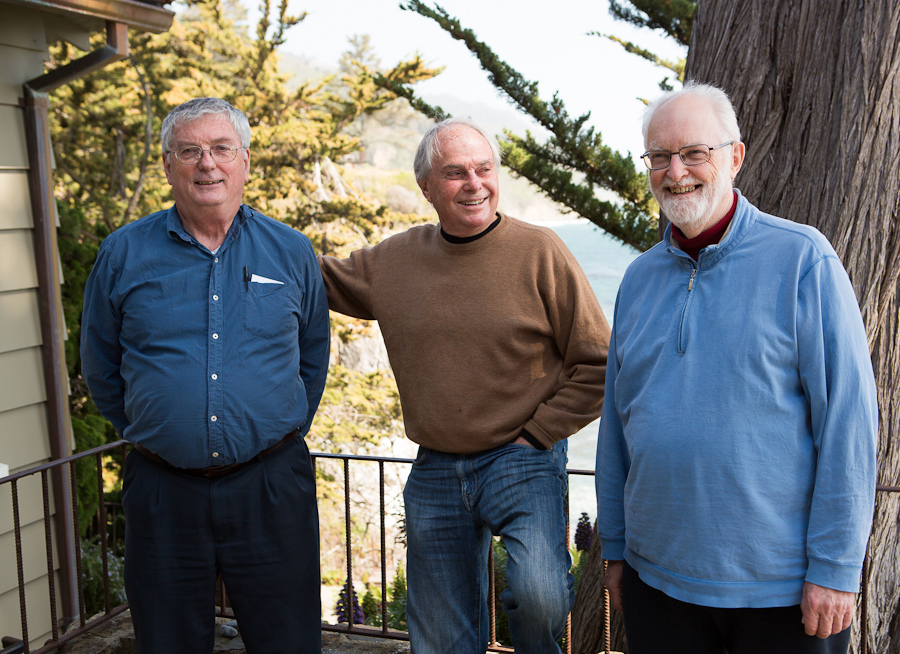 a group of men smiling